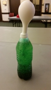 The Carbon Dioxide in the Alka Seltzer will partially fill a balloon stretched over the mouth of the bottle