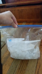 Large Ziploc Bag with ice and ice cream salt surrounding the smaller bag full of ice cream mixture